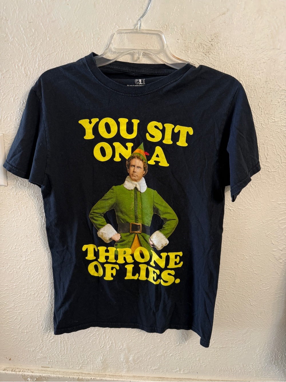 Ripple Junction Black Tee with Yellow Text and Green Elf Graphic